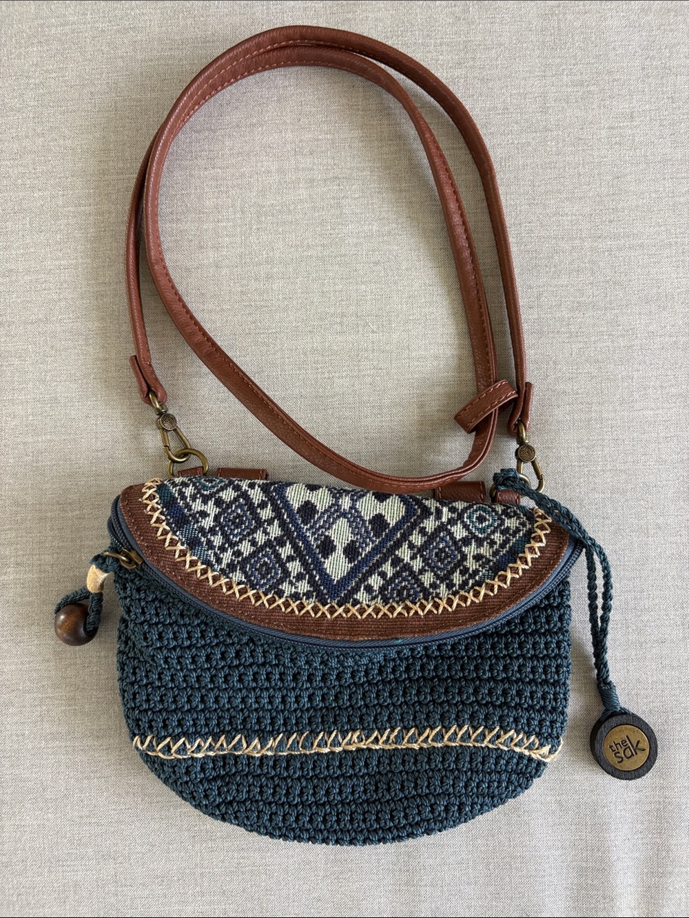The Sak Navy Crochet Crossbody with Brown Leather Strap